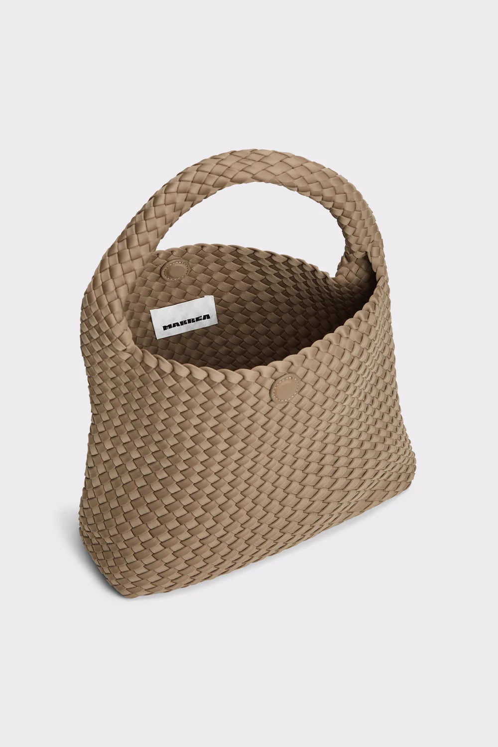 Woven beige handbag with a visible brand label on a light gray background