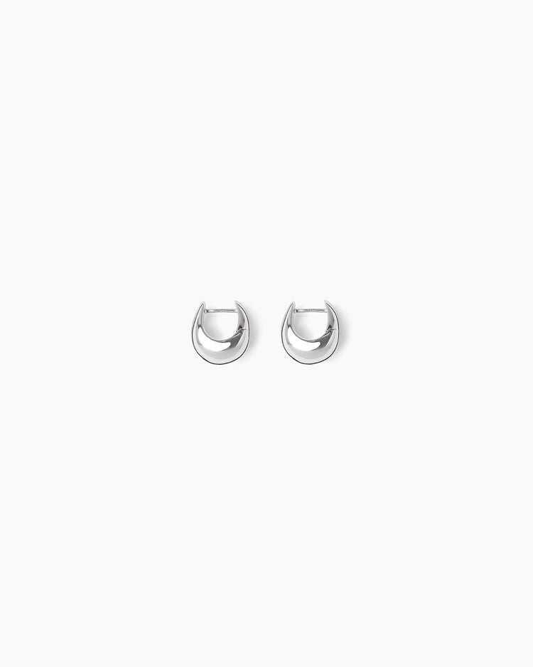A delicate yellow gold ring featuring three rows of small pavé-set clear stones, photographed on a clean, light off-white background.