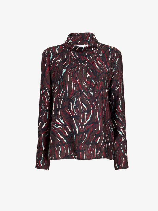 A long-sleeve mock neck blouse with an abstract brushstroke pattern in red, black, and white, shown against a plain light gray background.
