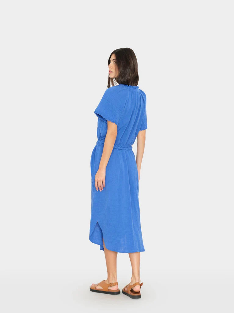Woman wearing a blue dress on a white background