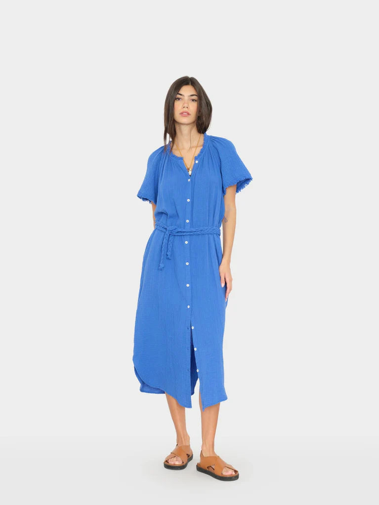 Woman wearing a blue dress on a white background